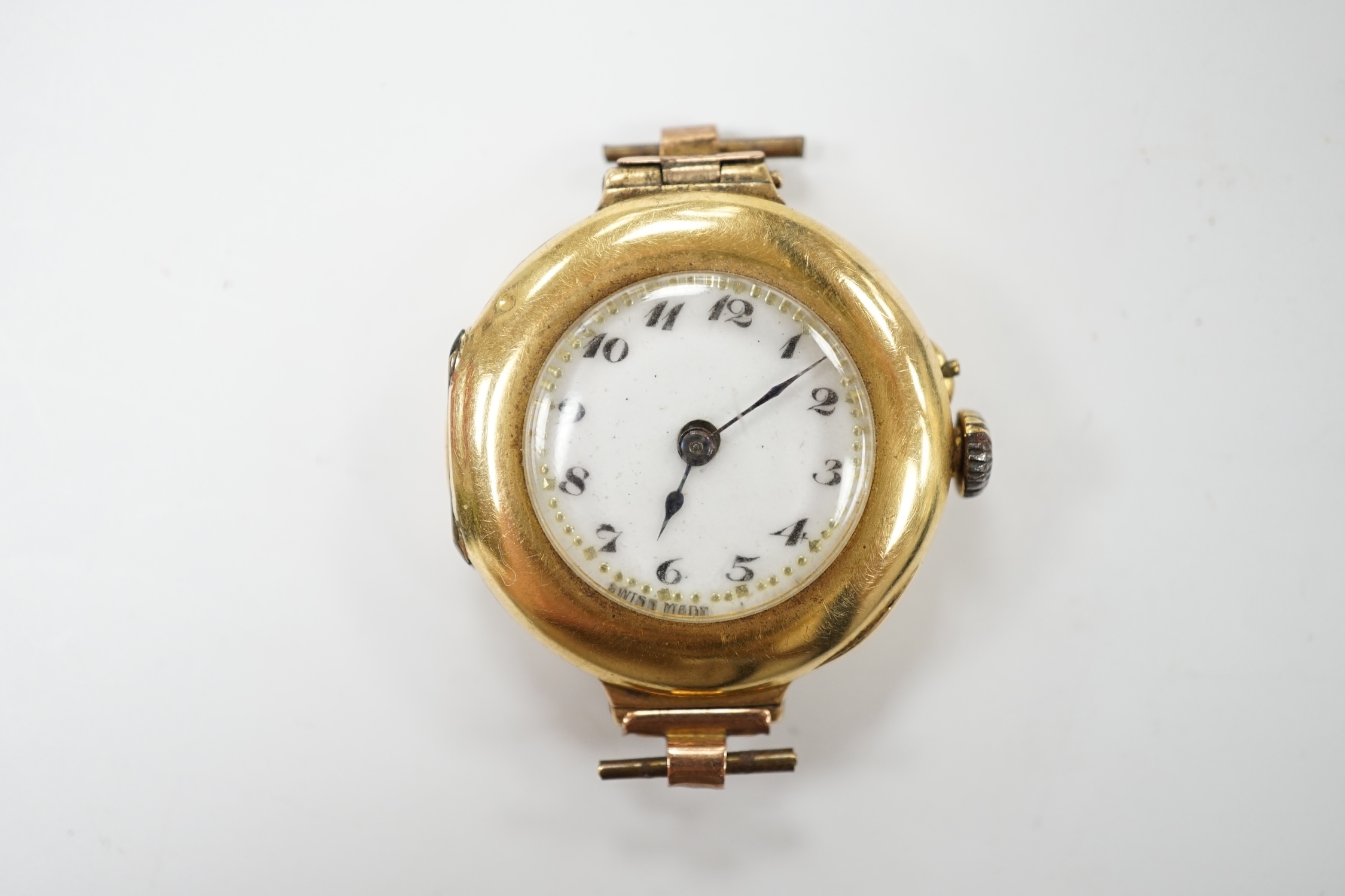 A lady's 18k manual wind wrist watch, with Arabic dial, no strap, gross weight 17.1 grams, Condition - poor